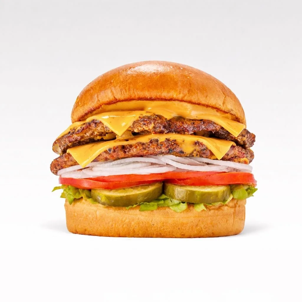 A Tony's double smash burger with cheese, onion, tomato, lettuce and pickles.